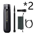 Starry sky black handheld cordless car vacuum cleaner with blowing hose accessory on a desktop.