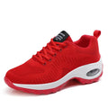 Women's red and black low top mesh sneakers with front lace-up and a flat mid heel on a white background.