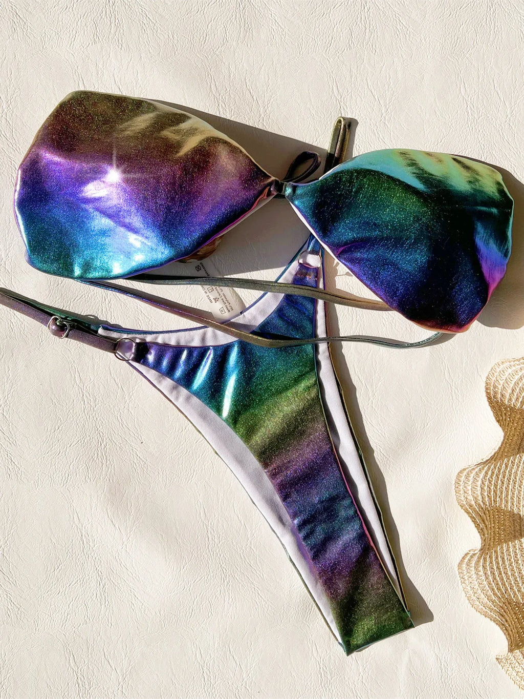 Women's gradient purple bikini swimsuit on a mannequin, showing the colour transition.