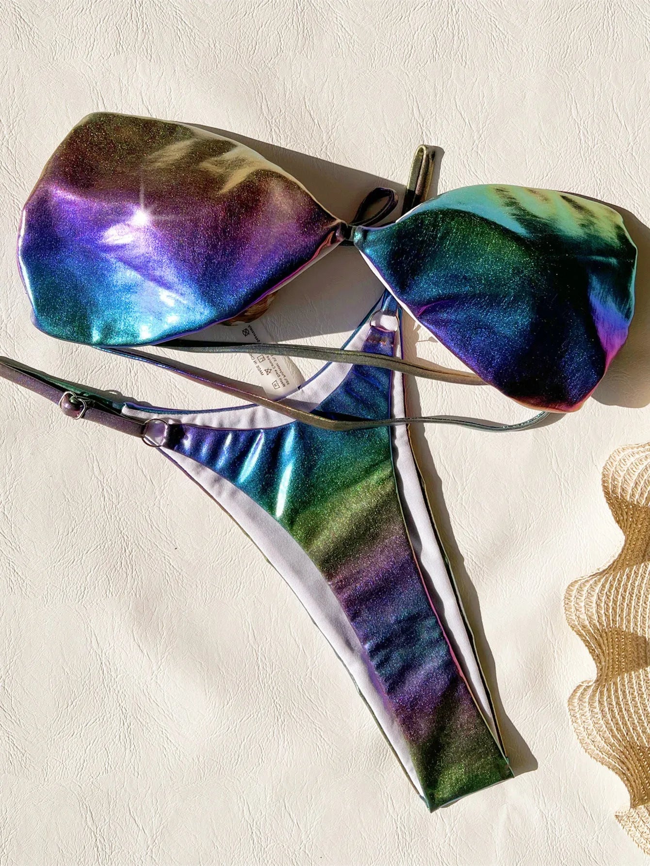 Women's gradient purple bikini swimsuit on a mannequin, showing the colour transition.