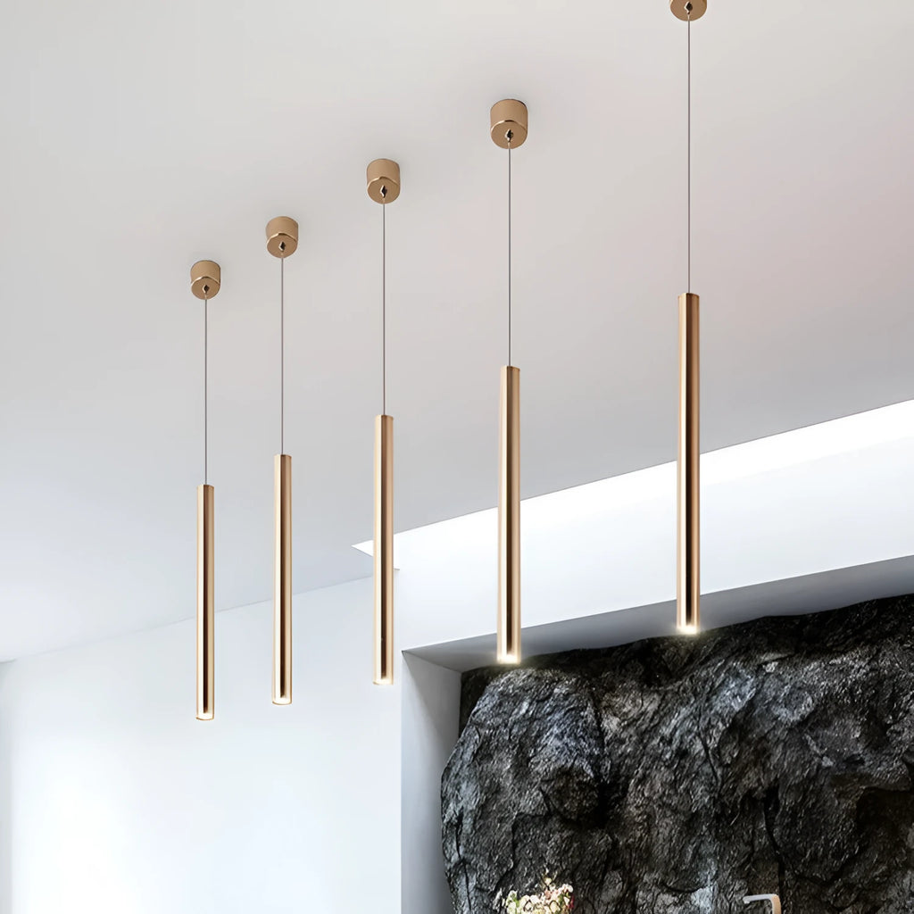 French gold long cylindrical iron chandelier with PMMA lampshade on simple modern background