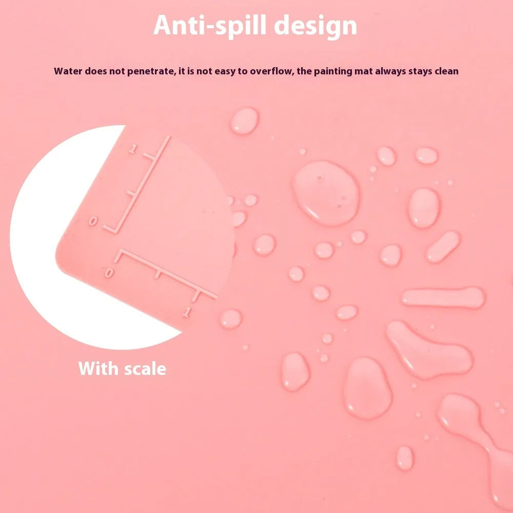 Light blue silicone painting mat measuring 50x40cm with two raised mixing bowls on its surface.