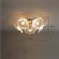 Modern creative ceiling chandelier with five white flower heads and warm lighting.