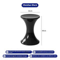 A plastic hourglass-style shoe changing stool, shown in one of the available colours.
