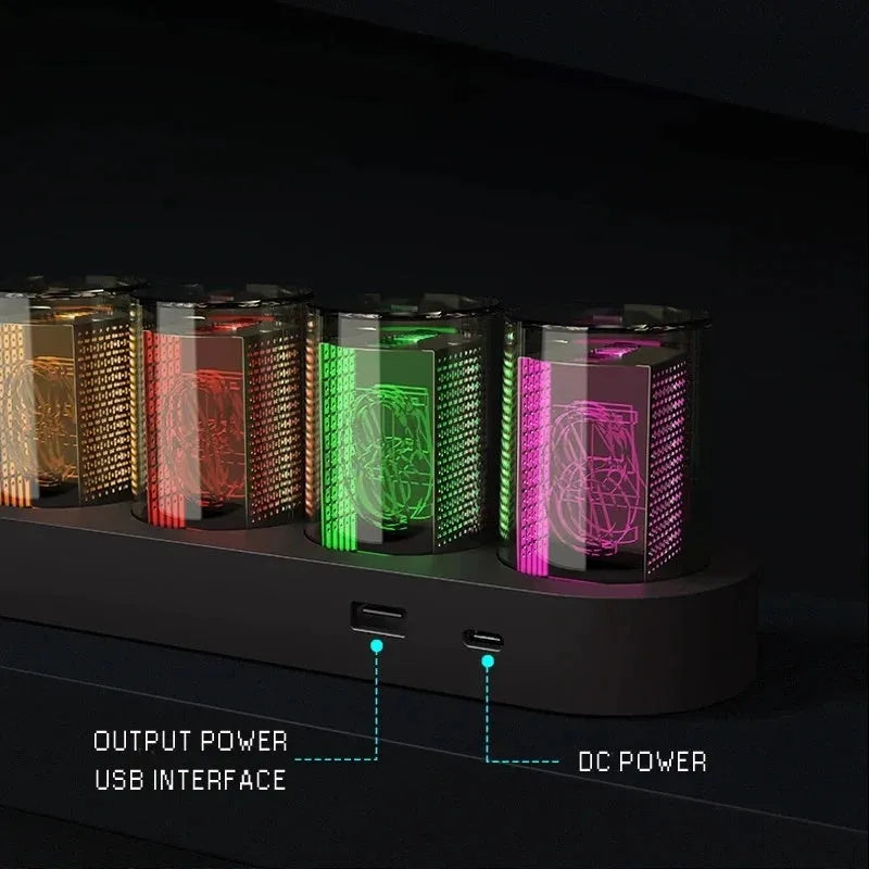 RGB Luminotron LED digital clock showing colourful display on desk with USB cable