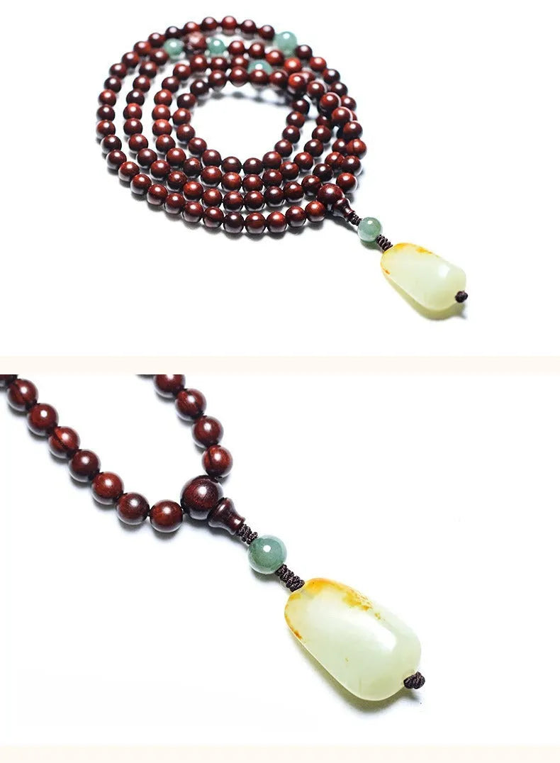 Rosewood bead bracelet with a carved Pterocarpus Santalinus and Hotian Jade stone pendant.