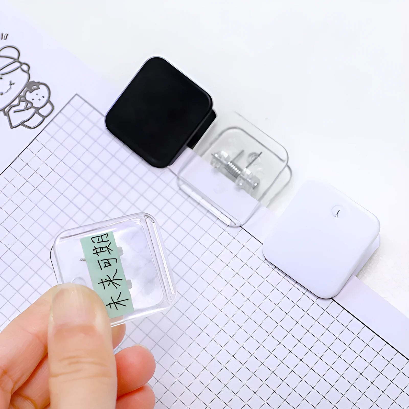 Square plastic photo note holder in white, black, and transparent colours measuring 3.2cm