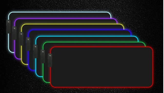 RGB luminous mouse pad with multi-colour LED lighting, fabric surface, and rubber base, shown on a desk with a mouse and keyboard