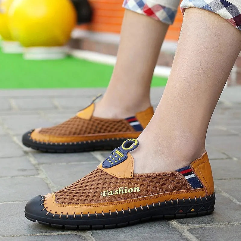 Men's brown casual mesh shoes with a round toe and non-slip rubber sole on a plain background.