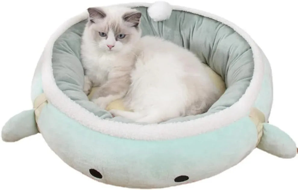 Green dinosaur and chick shaped cat bed shown both flat and hanging as a hammock.