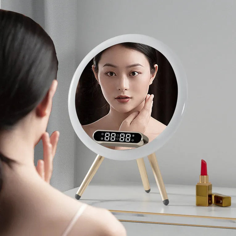 Multi-function LED mirror alarm clock with wireless charger and Bluetooth speaker in white, showing clock display and acrylic mirror surface