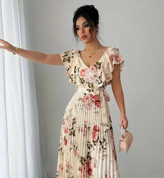 Apricot V-neck floral print dress with ruffled short sleeves and a full, high-waisted swing skirt.