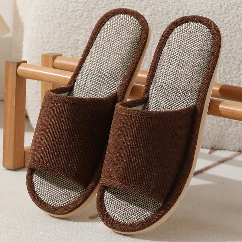 Women's open-toe linen slippers in a light brown colour showing the breathable fabric and thickened sole.