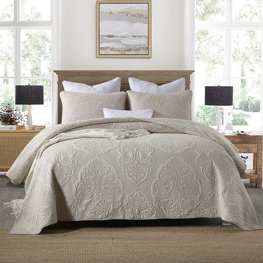 Three-piece pure cotton quilted bed cover set in white with Nordic floral embroidery on a 1.8m bed