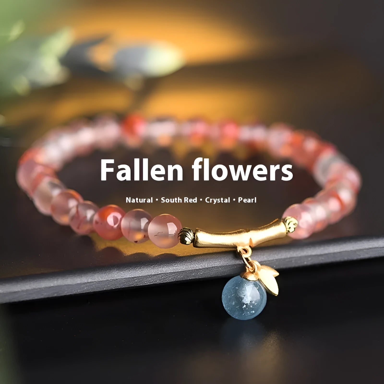 Polished Nanhong agate bracelet with ethnic bamboo-joint and flower design on a wrist.