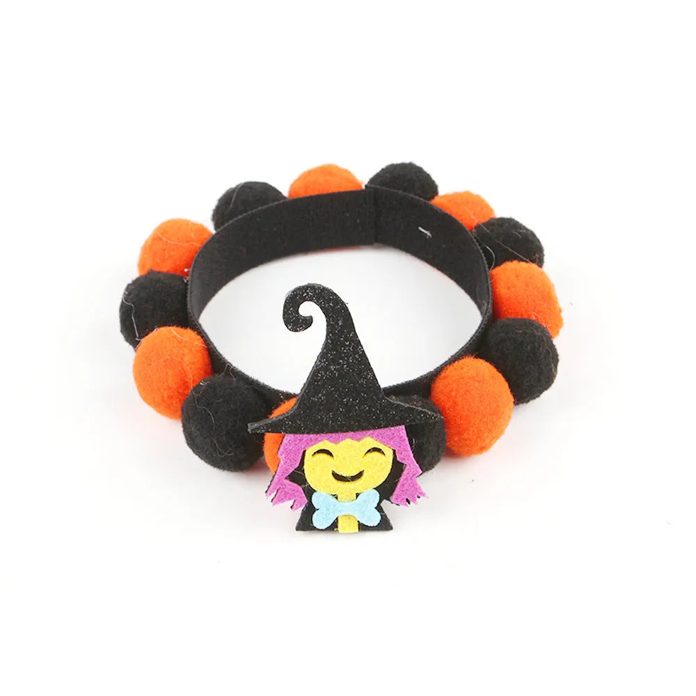 Halloween pet collar with a fur ball decoration in a pumpkin design, shown in size M.