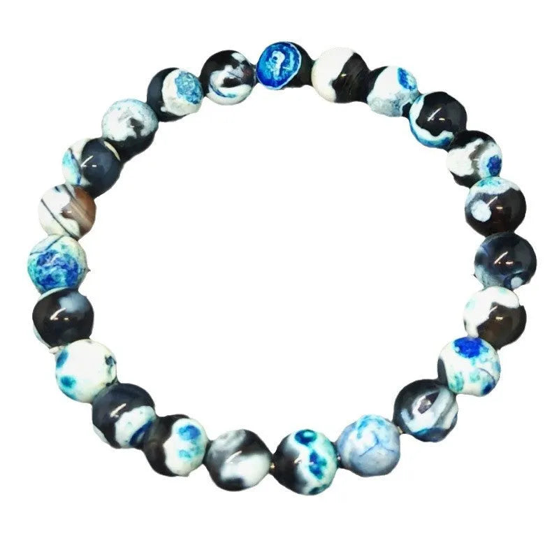 Close-up of a ladies bohemian bracelet with 8mm round glass beads in natural agate colours.