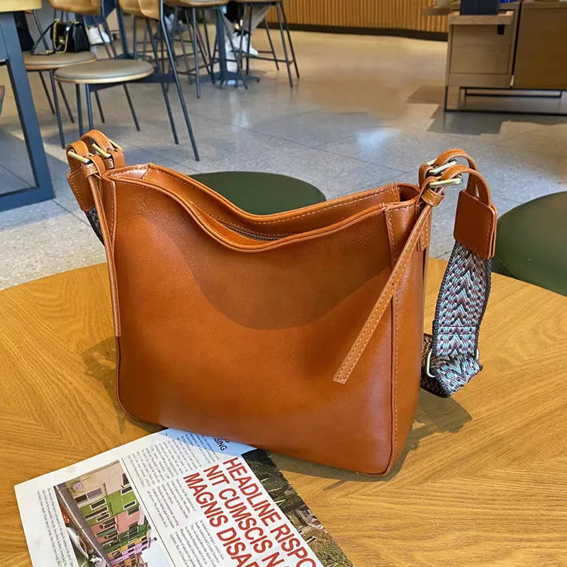 Women's leather shoulder messenger bag in square vertical shape with multiple compartments