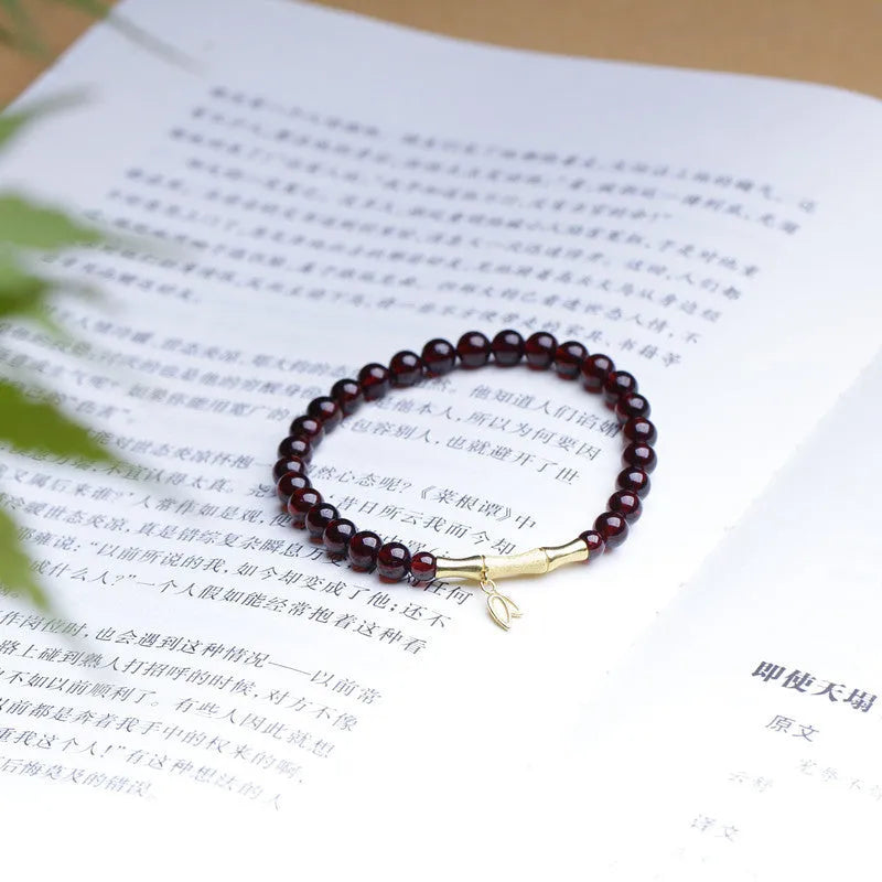 Handmade natural garnet bracelet with a 6mm silver or copper bamboo joint centrepiece.