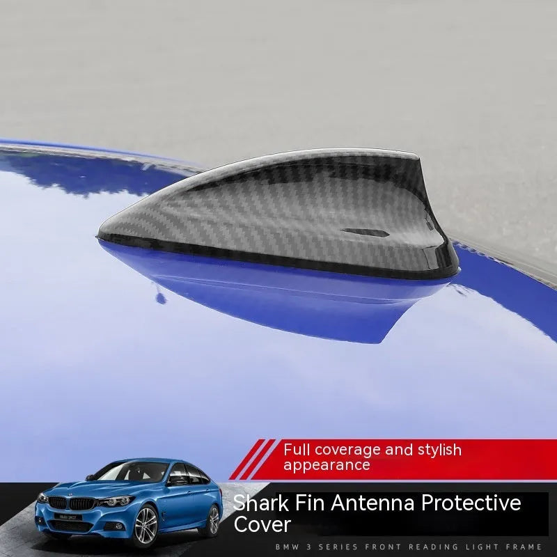 BMW shark fin antenna cover in carbon drill pattern and piano black finishes for Type A, B, and E models.