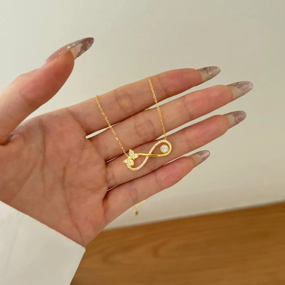 Mobius bow zircon clavicle chain in 925 sterling silver with electroplated gold or platinum finish and butterfly design