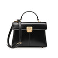 Black genuine leather women's shoulder bag with vachette clasp, showing horizontal square shape and adjustable strap.