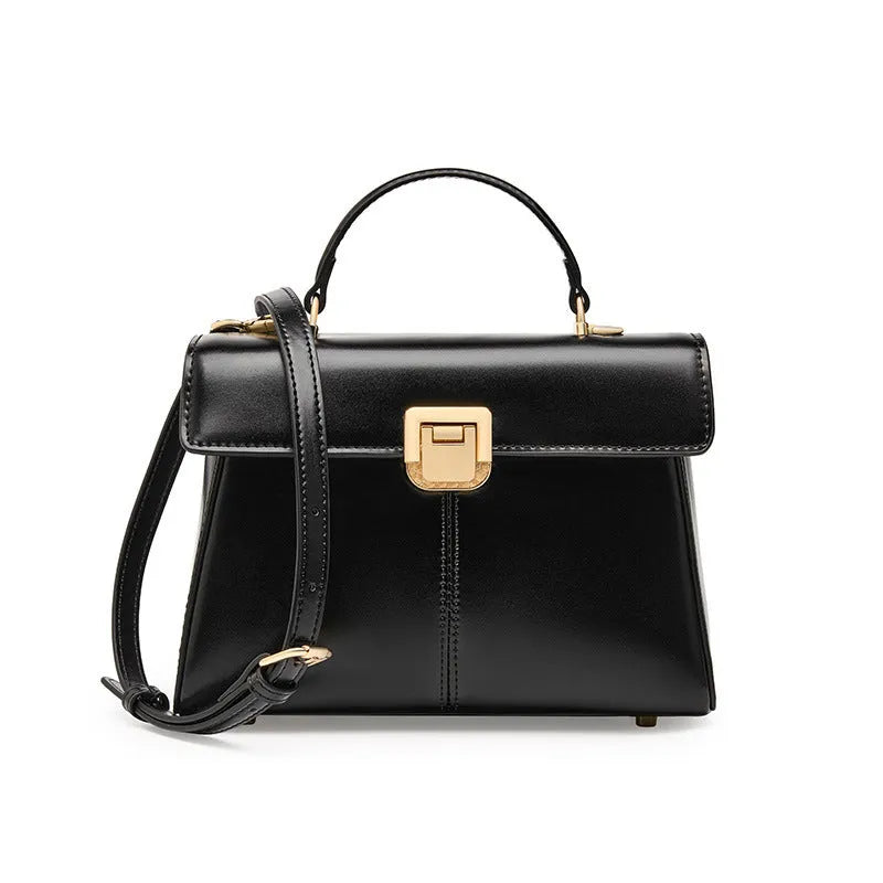 Black genuine leather women's shoulder bag with vachette clasp, showing horizontal square shape and adjustable strap.