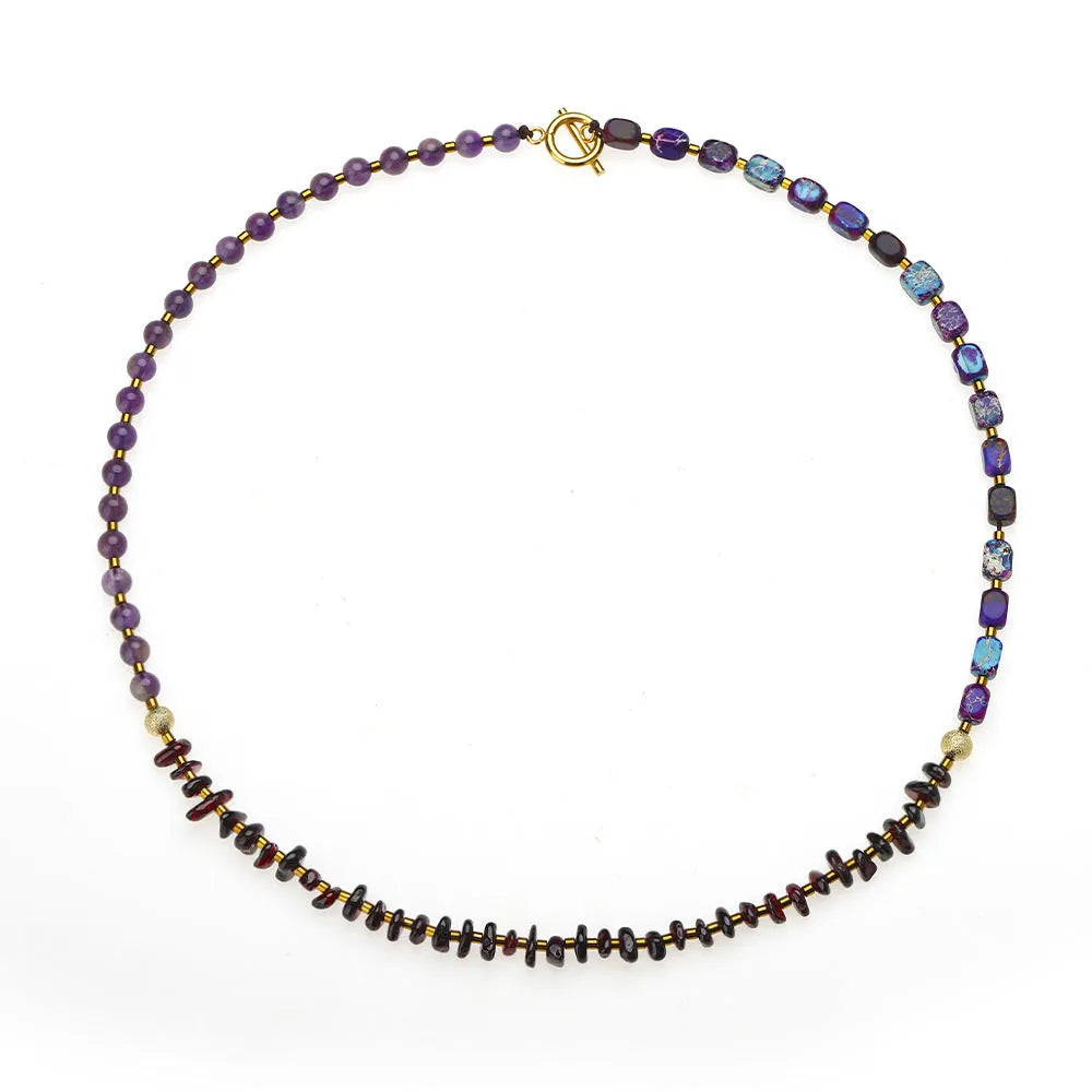 Purple amethyst and garnet stone bead bracelet with geometric design and manual craft details