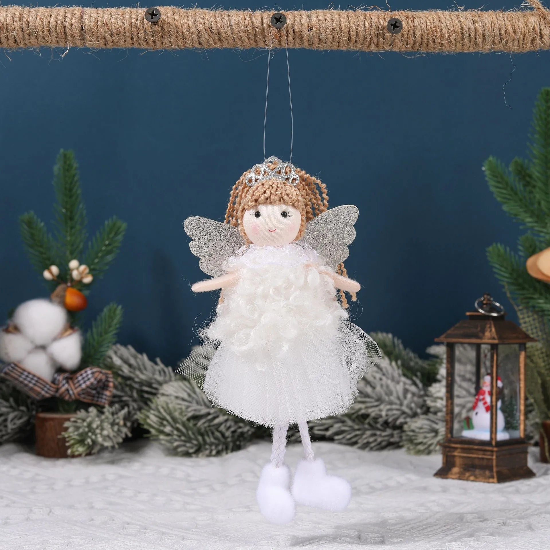 Close-up of a girl's cloth Christmas angel hair pendant clip in white, shown on a high ponytail.