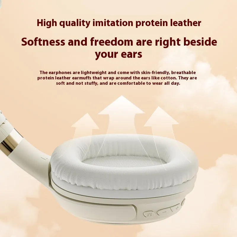 Cream coloured wireless Bluetooth over-ear gaming headset with microphone on a black background.