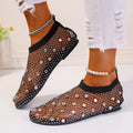 Women's flat mesh sandals with colourful rhinestone detail on a white background.