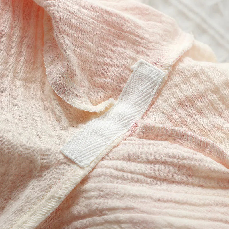 Women's pink pure cotton gauze two-piece suit with lace-up long sleeve top and full-length trousers.