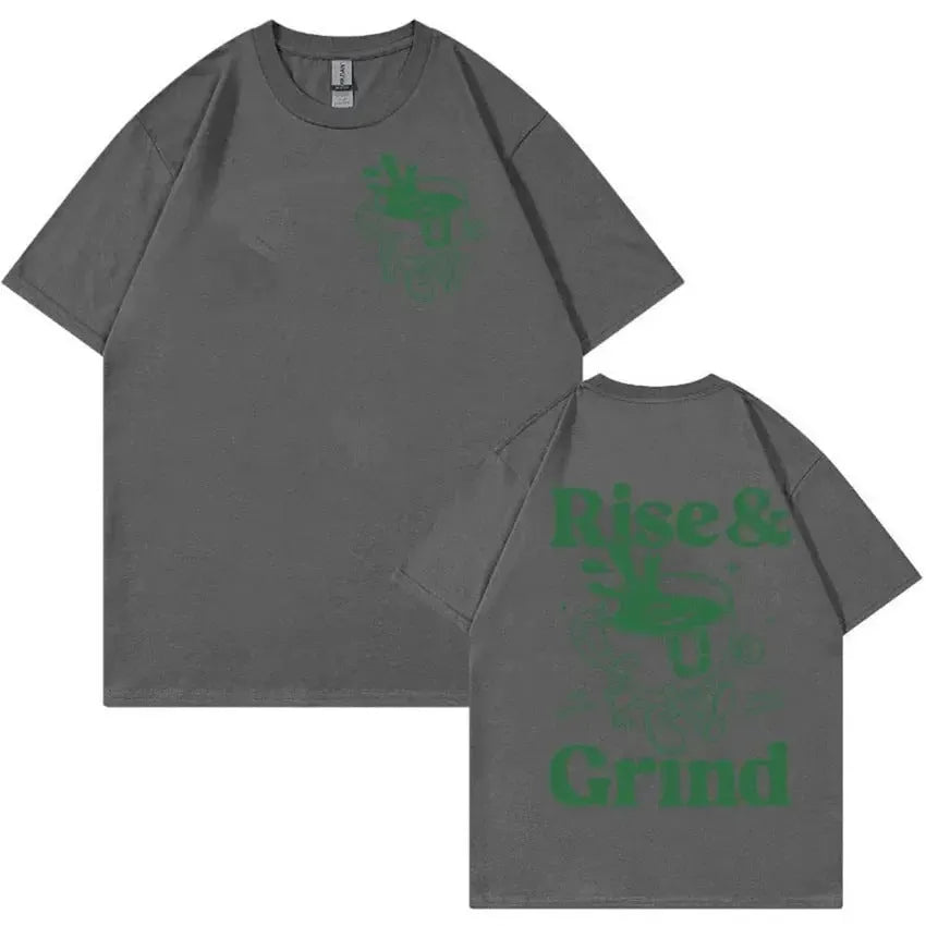 Loose fit linen t-shirt with a cartoon graphic of a green coffee bag and 'Rise And Grind' text.