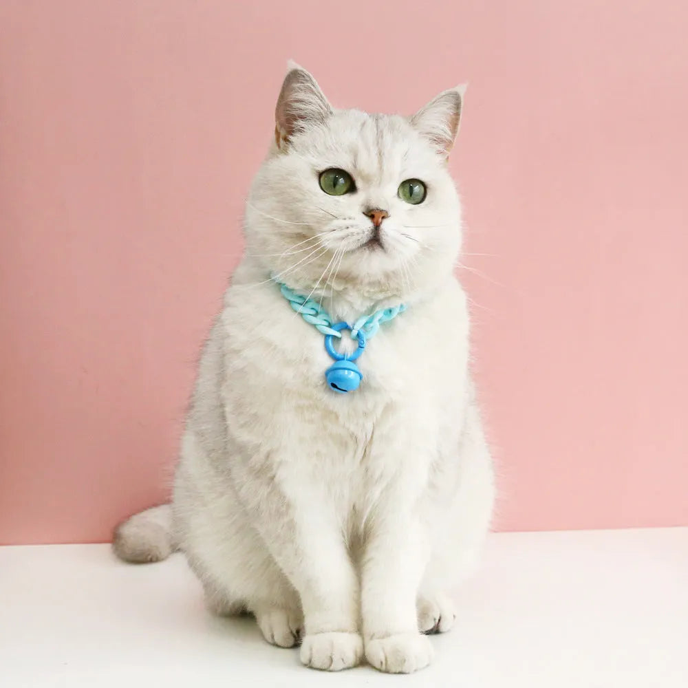 Soft plastic pet collar in pastel macaron candy colours with a chain-link design, shown in S and M sizes.