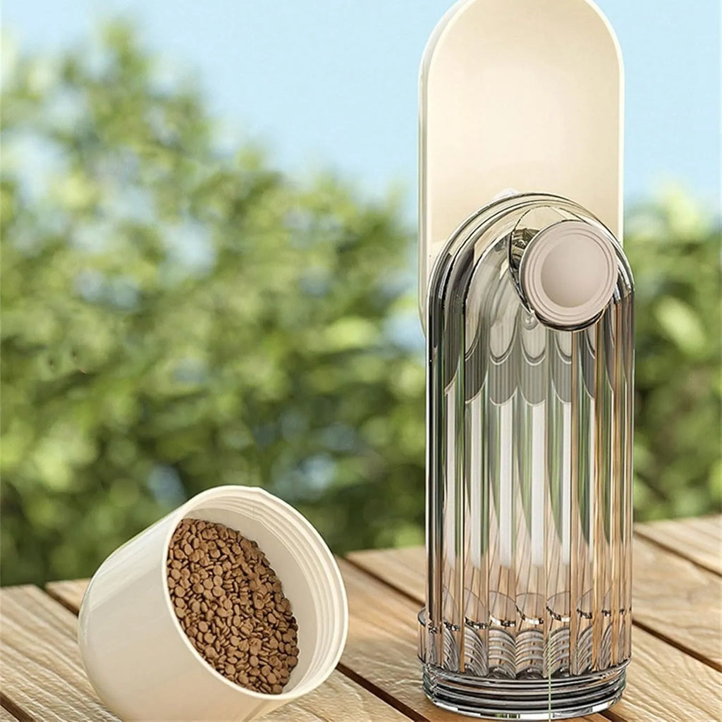 Beige and green foldable dog water bottle with food dispenser for outdoor use.