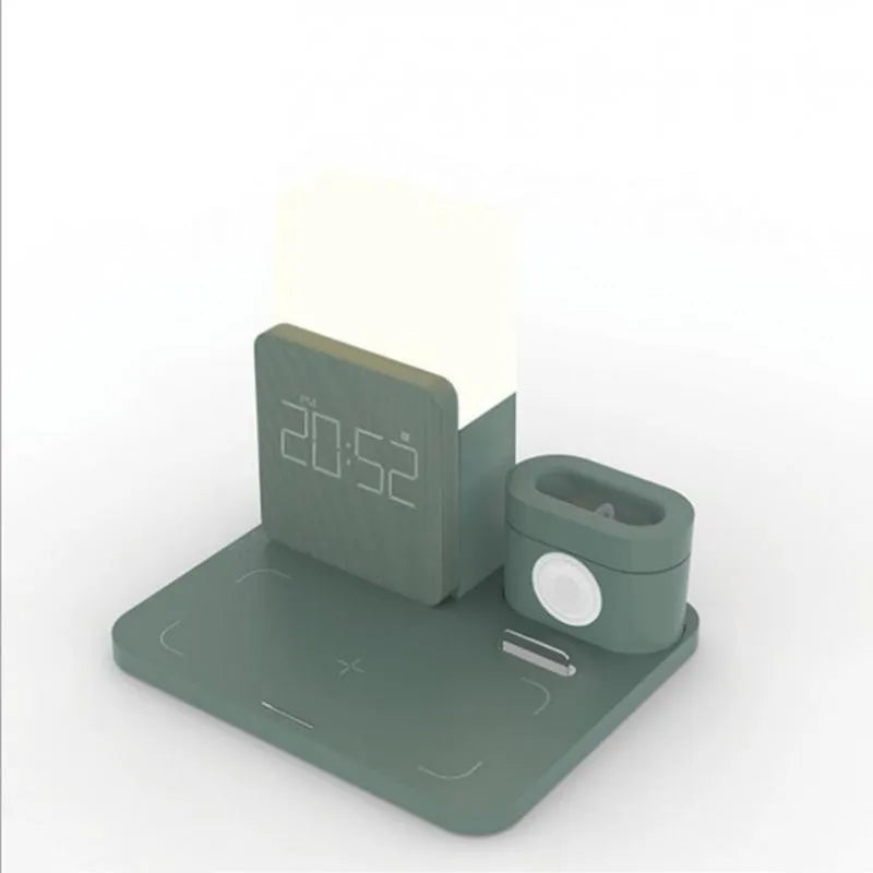 Dark green wireless charging stand holding a mobile phone and a pair of headphones.