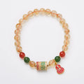 Hand-woven unisex bracelet with 6mm citrine beads in a five-sutra braid design.