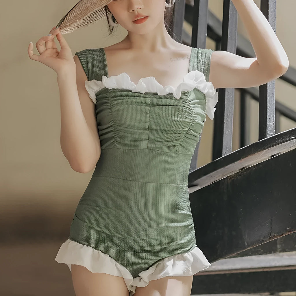 Korean-style high-waist one-piece swimsuit in black, pink, or green on a model