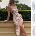 Blue long dress with white lace flower print, featuring a thigh slit and thin suspender straps.