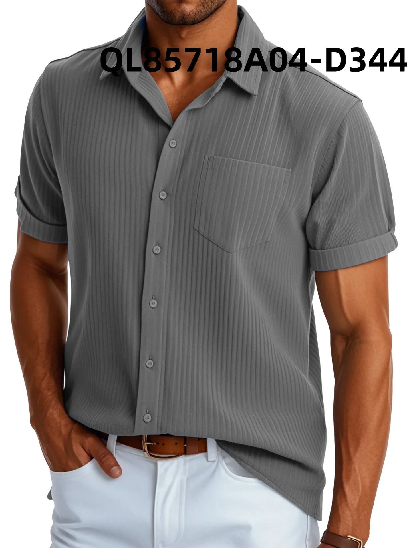 Man wearing a loose-fitting black and white printed short sleeve lapel shirt made of polyester.
