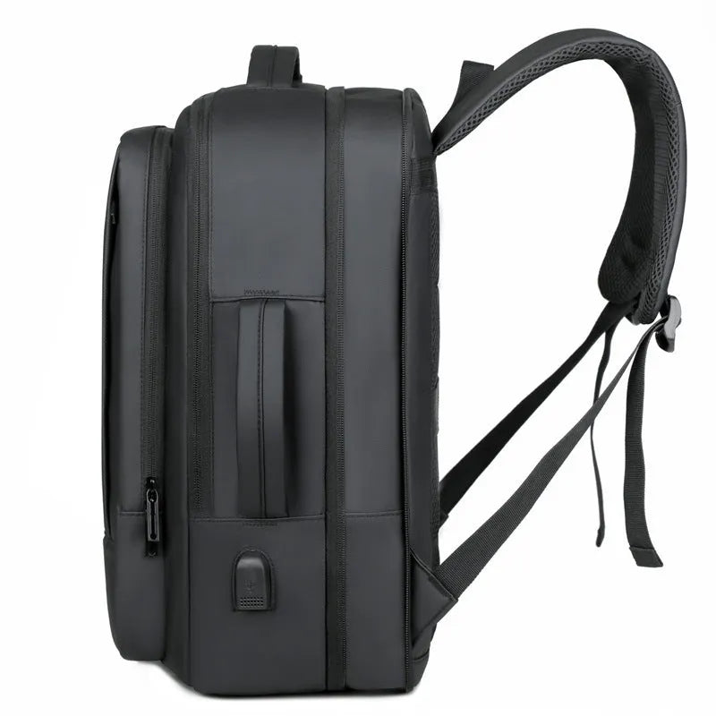 Men's black waterproof backpack with curved shoulder straps and 20-35L capacity for business travel