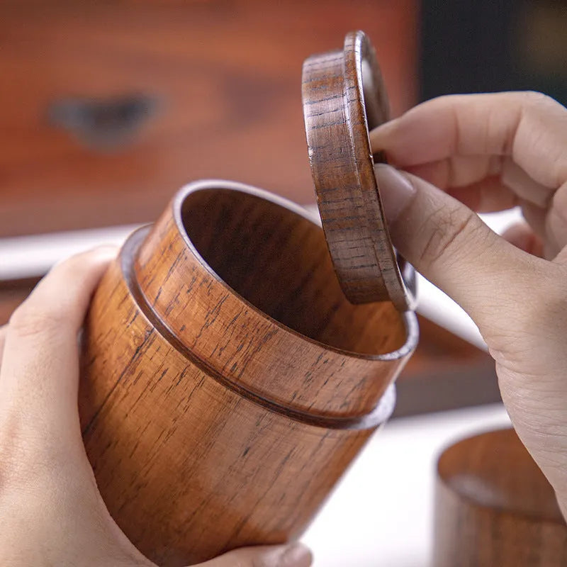 Hand-painted jujube wood sealed tea container with 200ml capacity on a wooden surface