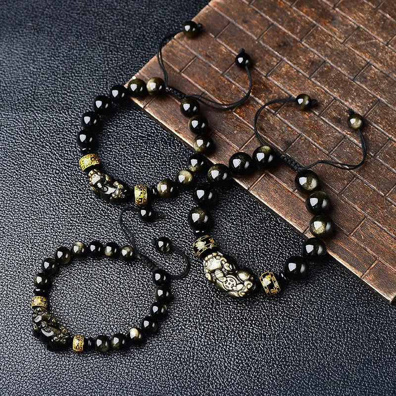 Hand-woven golden obsidian Pi Xiu bracelet with zodiac design in multiple bead sizes