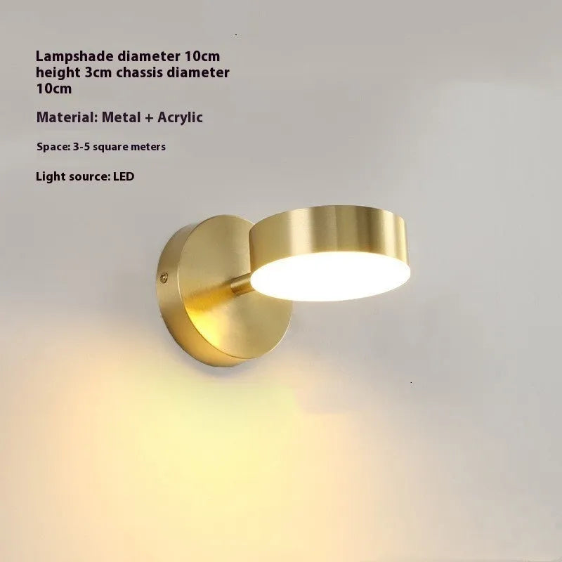 Rotatable bedside wall lamp with golden mirror front in gold finish mounted on wall