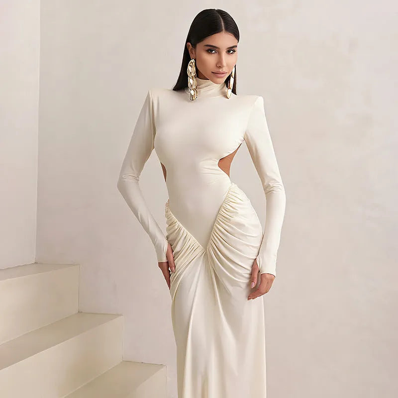 Slim fit long sleeve high collar dress with pleated backless detail in a solid colour.