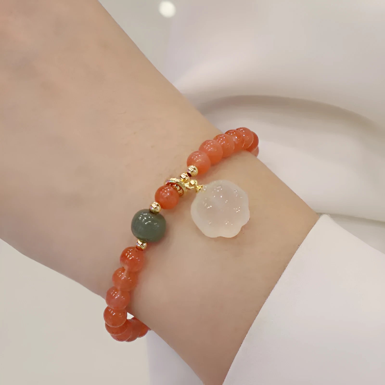 Red agate women's bracelet with cat's paw charm and jade inlay on 6mm band