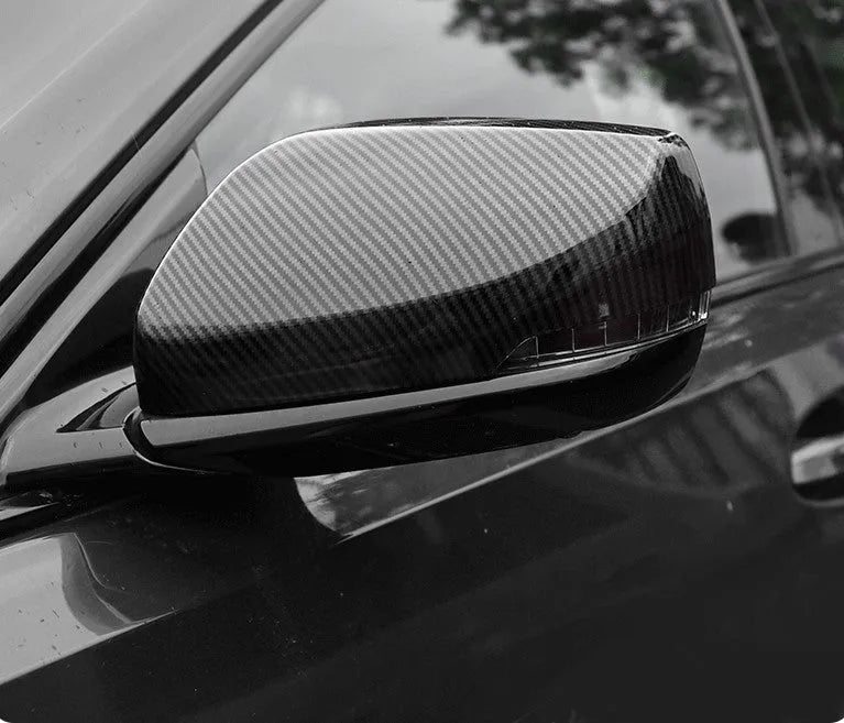 Pair of ABS rearview mirror covers for Cadillac CT5 CT6 in carbon fibre, silver, and rain frame styles.