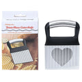 Stainless steel potato wave knife with corrugated blade on a wooden cutting board