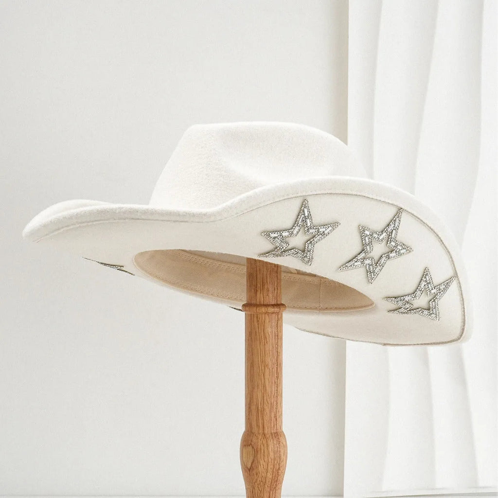 Beige western-style conical top hat with a hexagonal star decoration on the front.