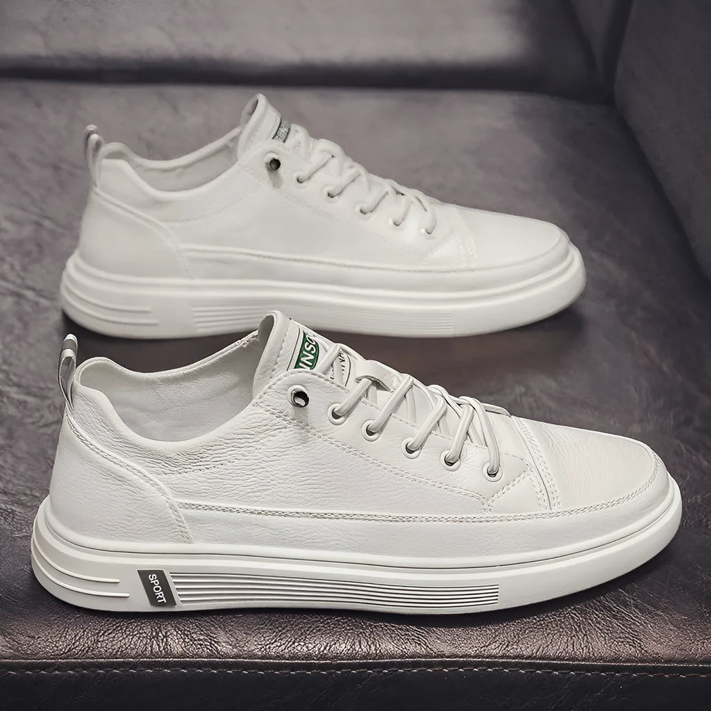 Men's casual white flat shoes with round toe and shallow mouth design on a plain background